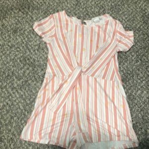 A romper with gold hearts on it